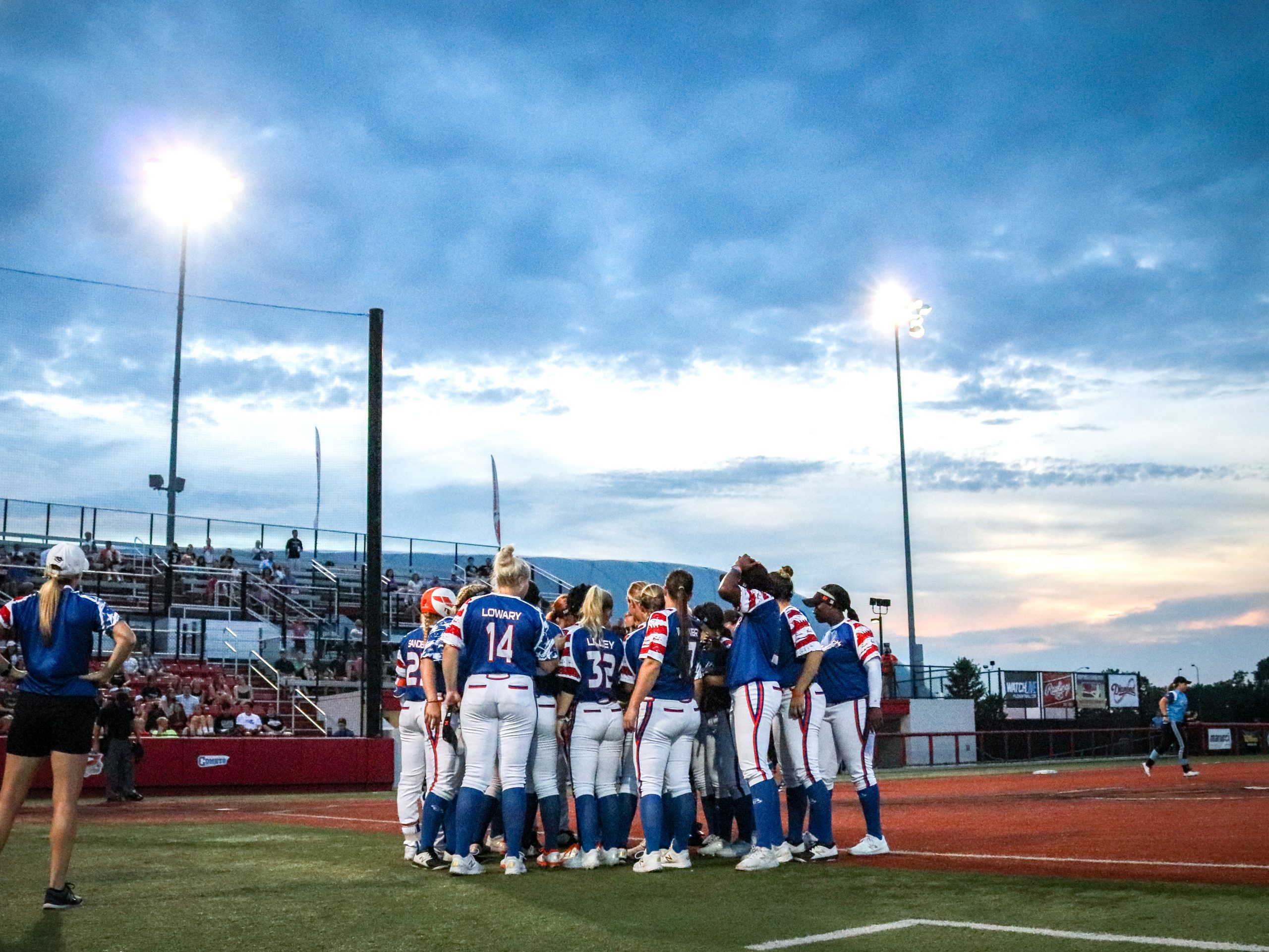 softball players in a huddle