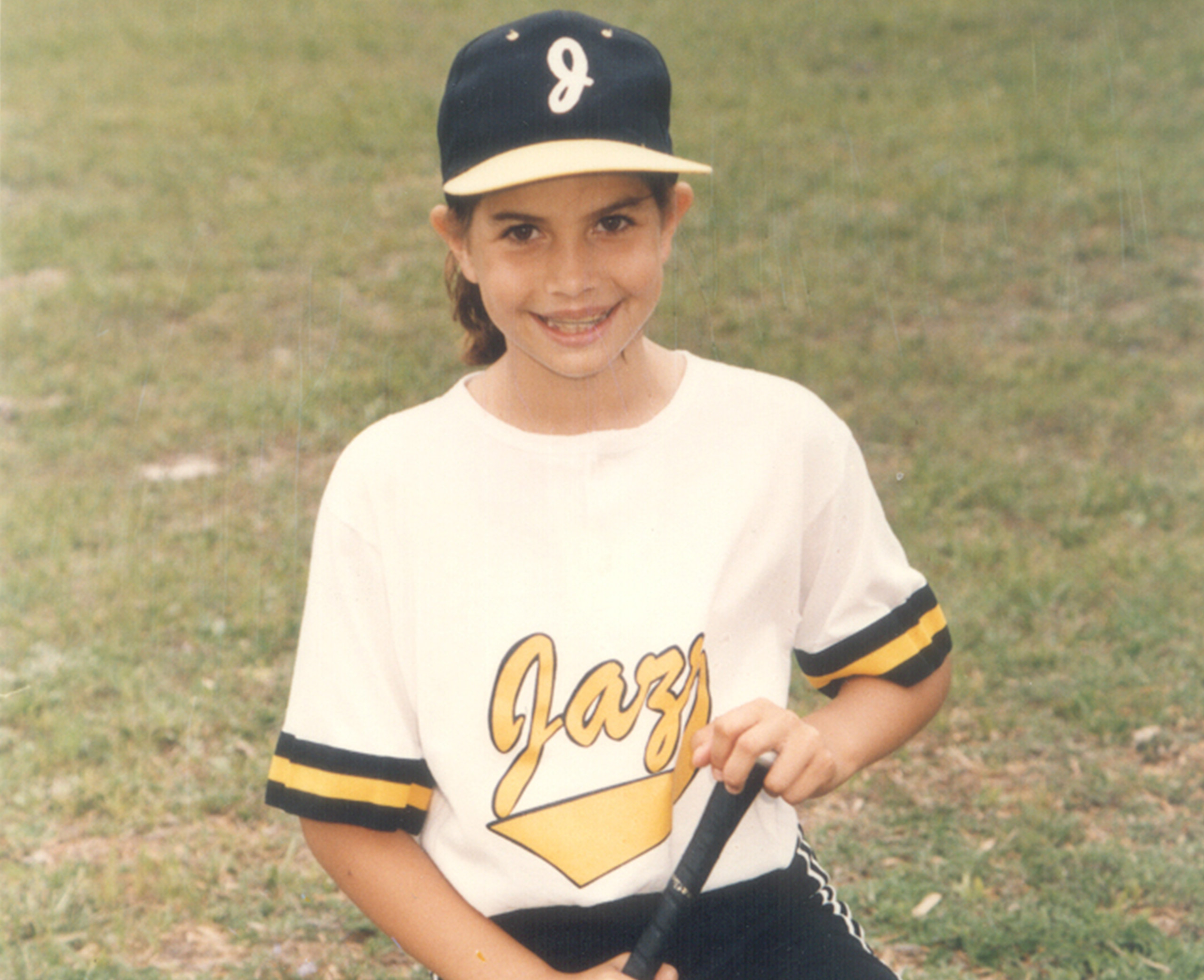 Young Cat Osterman in her Little League uniform.