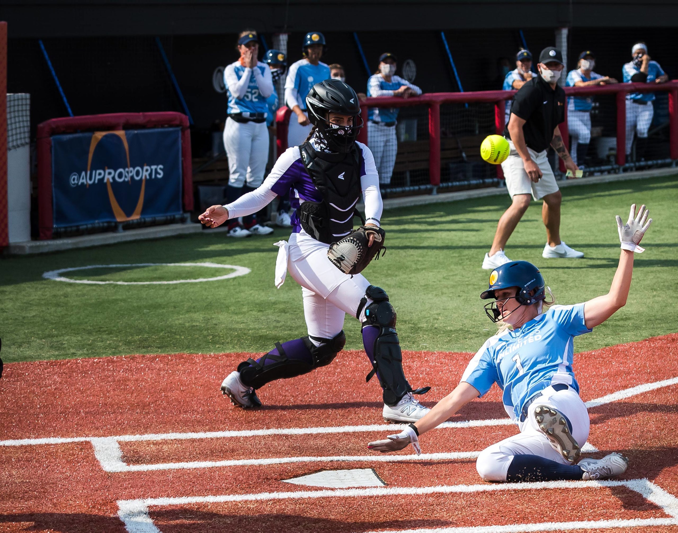 A runner scores at home plate.
